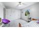 This bedroom features a ceiling fan, a window, and closet space for storage at 3331 Daniel St, Mooresville, IN 46158