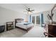 Comfortable bedroom with balcony access, a cozy color scheme, and plenty of closet space at 3331 Daniel St, Mooresville, IN 46158
