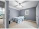Neutral bedroom with a fan, window, and closet for storage and natural light at 3331 Daniel St, Mooresville, IN 46158