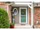 Inviting front entrance with charming decor and a well-maintained brick exterior at 3331 Daniel St, Mooresville, IN 46158
