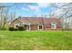 Charming brick home with a well-manicured lawn and inviting entrance for a warm, welcoming curb appeal at 3331 Daniel St, Mooresville, IN 46158