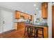 Modern kitchen with updated appliances, granite countertops, and an island with breakfast bar seating for casual dining at 3331 Daniel St, Mooresville, IN 46158