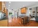 Bright, open kitchen featuring wooden cabinetry, stainless steel appliances and hardwood floors at 3331 Daniel St, Mooresville, IN 46158