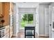 Bright, open kitchen area with stainless steel appliances, wood cabinets, and hardwood floors at 3331 Daniel St, Mooresville, IN 46158