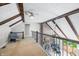 Loft featuring wood beams, carpeted floors, and an overlook to the living space below at 3331 Daniel St, Mooresville, IN 46158
