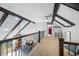 Loft featuring wood beams, carpeted floors, and an overlook to the living space below at 3331 Daniel St, Mooresville, IN 46158
