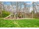 Fun playground in a backyard setting with a slide, swings, and climbing features for outdoor entertainment at 3331 Daniel St, Mooresville, IN 46158