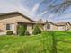 Well-maintained backyard with manicured lawn and landscaping at 3629 Woodglen Way, Anderson, IN 46011
