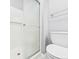 White bathroom with a glass shower and modern fixtures at 3629 Woodglen Way, Anderson, IN 46011