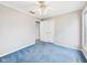 Bedroom with blue carpet, neutral walls, and double-door closet at 3629 Woodglen Way, Anderson, IN 46011