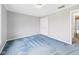 Neutral bedroom with blue carpet and a closet at 3629 Woodglen Way, Anderson, IN 46011