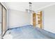Dining room with a hanging light fixture above blue carpet and open doorway at 3629 Woodglen Way, Anderson, IN 46011