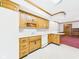 Well-lit kitchen boasts ample cabinet space and white appliances at 3629 Woodglen Way, Anderson, IN 46011