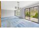 Spacious living area with large windows and access to the backyard via a sliding glass door at 3629 Woodglen Way, Anderson, IN 46011