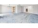 Open living room with light gray walls, carpet, and access to other rooms at 3629 Woodglen Way, Anderson, IN 46011