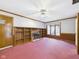 Comfortable living room featuring wood trim, a brick fireplace, built-in shelves, and natural light at 3629 Woodglen Way, Anderson, IN 46011