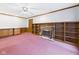 Cozy living room with a brick fireplace, built-in bookshelves, and a ceiling fan at 3629 Woodglen Way, Anderson, IN 46011