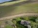 An aerial view of the property, highlighting its location near open fields and ample outdoor space at 3703 E Gore St, Columbus, IN 47201