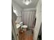 Bathroom featuring a pedestal sink, toilet, and bathtub with shower featuring neutral decor at 3703 E Gore St, Columbus, IN 47201