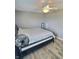 Bedroom with wood-look floors and neutral walls offering a clean, minimalist space at 3703 E Gore St, Columbus, IN 47201