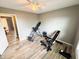 Neutral bedroom featuring light-colored floors, a ceiling fan, and exercise equipment at 3703 E Gore St, Columbus, IN 47201