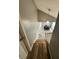 View of the dining room with dark wood furniture from the top of the stairs at 3703 E Gore St, Columbus, IN 47201