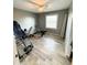 Flex room with hardwood floors, natural light, and ample space for various activities at 3703 E Gore St, Columbus, IN 47201