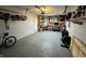 Well-lit garage with ample storage space and a variety of tools and equipment at 3703 E Gore St, Columbus, IN 47201