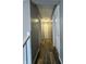 Hallway featuring neutral paint, wood floors and white doors leading to various rooms at 3703 E Gore St, Columbus, IN 47201