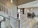 Open concept view of the kitchen featuring stainless steel appliances, wood floors, and dining area at 3703 E Gore St, Columbus, IN 47201