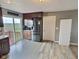 Spacious kitchen with stainless steel refrigerator and sliding door leading to the deck at 3703 E Gore St, Columbus, IN 47201