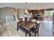 Open concept kitchen and dining area with stainless steel appliances and a sliding glass door to the outside deck at 3703 E Gore St, Columbus, IN 47201