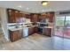 Modern kitchen featuring stainless steel appliances, granite countertops and dark wood cabinetry at 3703 E Gore St, Columbus, IN 47201