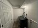 The laundry room features a modern washer and dryer hookup and a door for privacy at 3703 E Gore St, Columbus, IN 47201