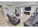 Cozy living room with wood burning stove, TV, and comfortable seating at 3703 E Gore St, Columbus, IN 47201