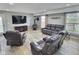 Inviting living room featuring comfortable seating, a wood burning stove, and view of the backyard at 3703 E Gore St, Columbus, IN 47201