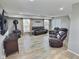 Comfortable living room with a wood burning stove, TV, and access to the outside deck at 3703 E Gore St, Columbus, IN 47201