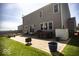 Outdoor patio with a dining set, grassy area, and a fenced backyard at 3896 Woods Bay Ln, Plainfield, IN 46168