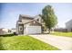 Charming two-story home with a well-manicured lawn and long driveway at 3896 Woods Bay Ln, Plainfield, IN 46168