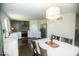 Bright kitchen with sleek appliances, modern cabinetry, and dining area with chandelier at 3896 Woods Bay Ln, Plainfield, IN 46168