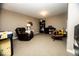 Spacious living room with carpet, a comfortable recliner, and ample room for entertainment at 3896 Woods Bay Ln, Plainfield, IN 46168