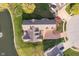 Aerial view showcasing backyard deck, and lush landscaping with pond at 4052 Diamond Row, Greenwood, IN 46143