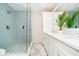 Bright bathroom with glass shower, stylish vanity, and white countertops at 4052 Diamond Row, Greenwood, IN 46143