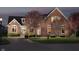 Charming brick home with a well-manicured lawn, mature trees, and a cozy, inviting entrance at 4052 Diamond Row, Greenwood, IN 46143