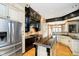 Modern kitchen with stainless steel appliances, dark countertops, and white cabinetry at 4052 Diamond Row, Greenwood, IN 46143