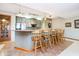 Basement kitchenette with stainless steel appliances and island seating at 4052 Diamond Row, Greenwood, IN 46143