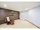 Cozy living area with wood accent wall, comfortable chair, and stylish decor at 4052 Diamond Row, Greenwood, IN 46143