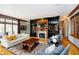 Cozy living room with fireplace, custom built-ins, and hardwood floors at 4052 Diamond Row, Greenwood, IN 46143