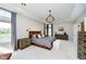 Spacious main bedroom with large windows, stylish lighting, and neutral decor at 4052 Diamond Row, Greenwood, IN 46143
