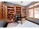Home office with custom built-in shelving, dark marble floors, and a window at 4052 Diamond Row, Greenwood, IN 46143